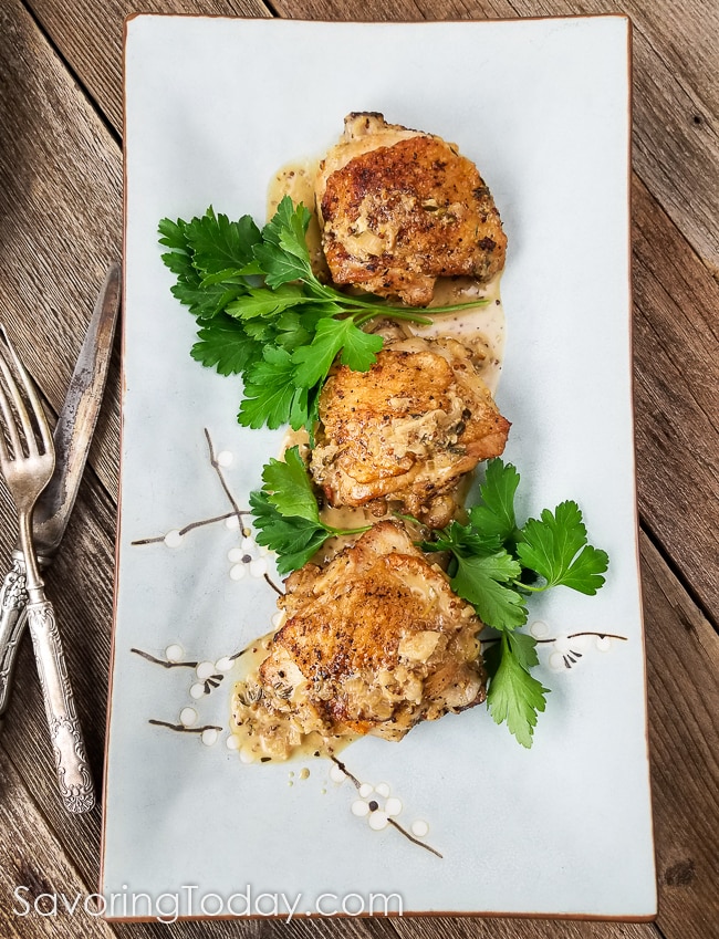 This Stone Ground Mustard-Braised Chicken recipe is one of those fail-proof dishes that make you look good without having to overthink it. Bone-in chicken thighs braised in white wine and stone ground mustard with a touch of cream is easy enough for weeknight dinners and nice enough to impress company. Recipe includes 5 Tips for Fail-Proof Sauces. #chickendinner #chickenrecipe #cleaneating #sauces #easyrecipes